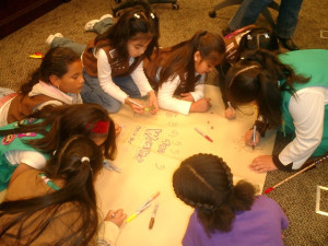 DALLAS girls making drum at women's museum