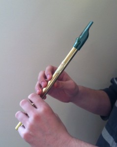 holding the tin whistle